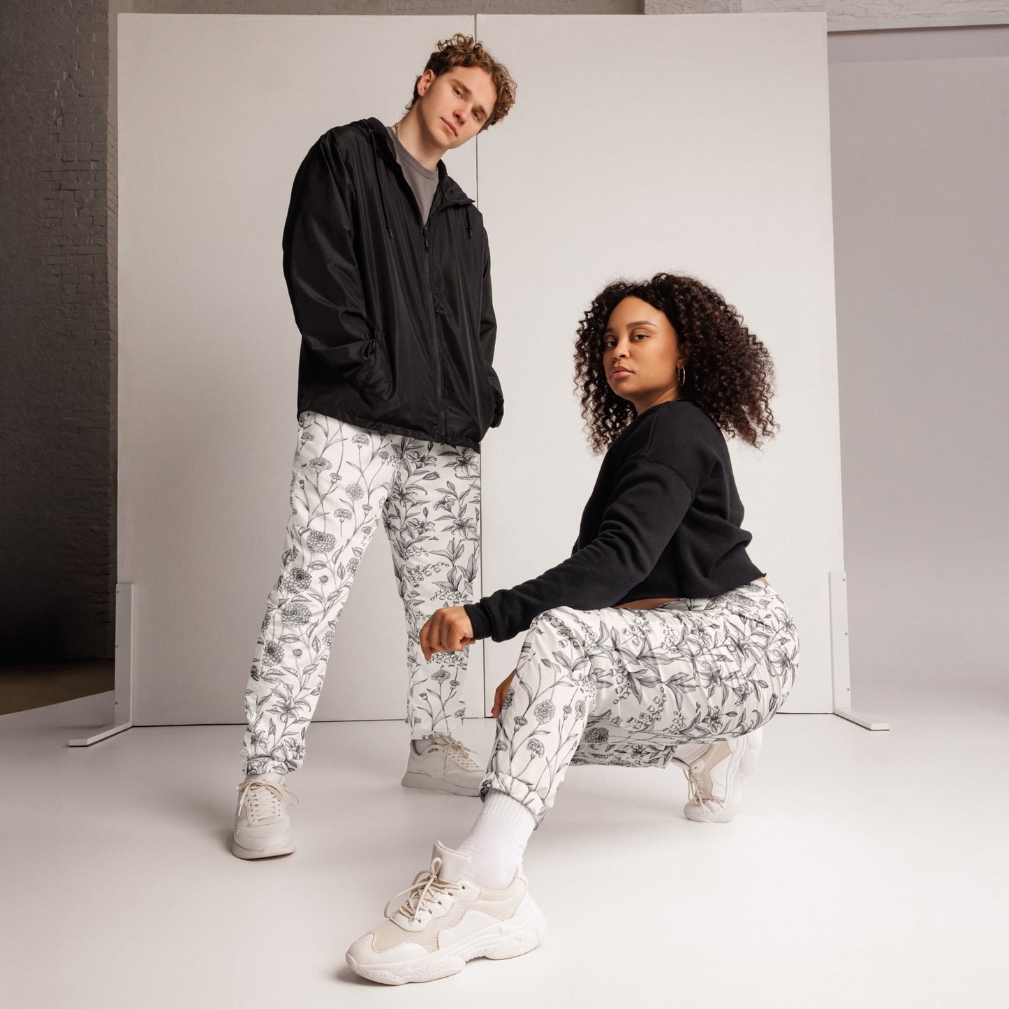 Image 1 of selected colour Florabed Track Pants - Left Placement, size XS, with Flower Bed artwork visible in front view.