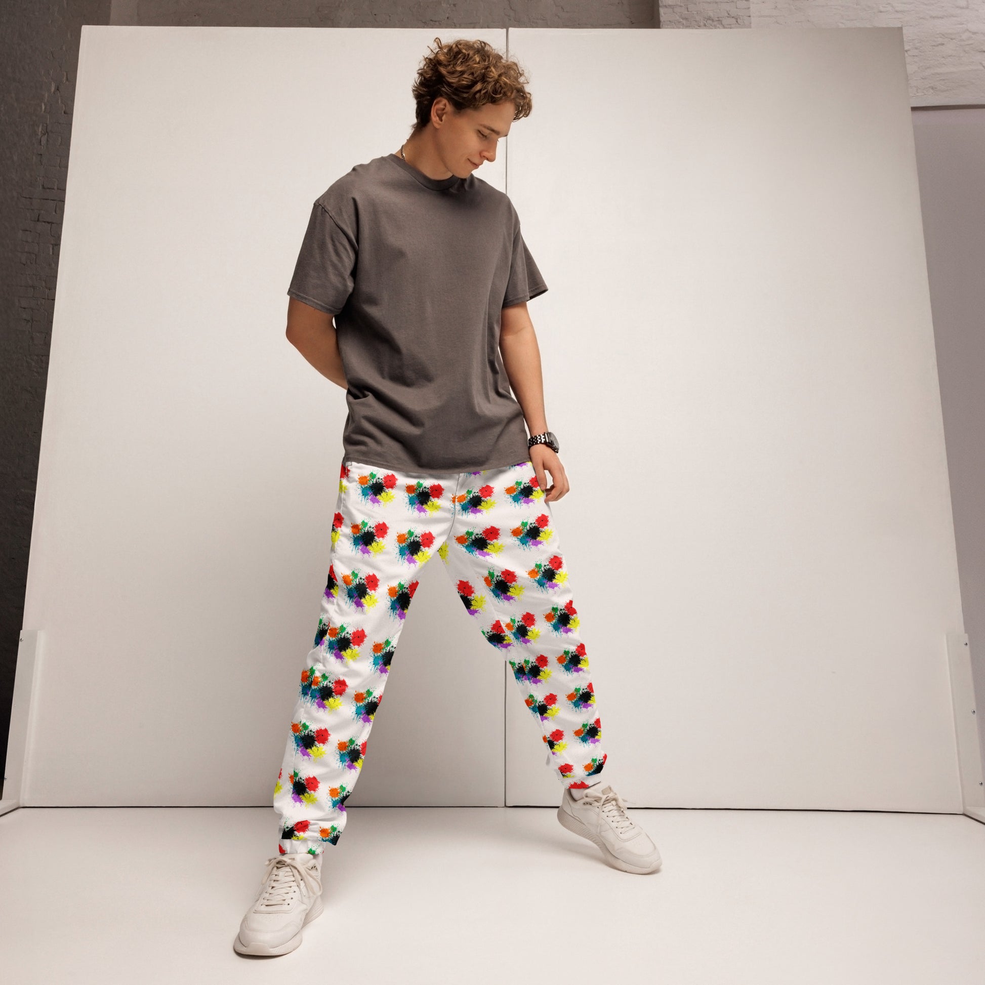 Image 1 of selected colour Splattermark Track Pants - Left Placement, size XS, with Splate artwork visible in front view.