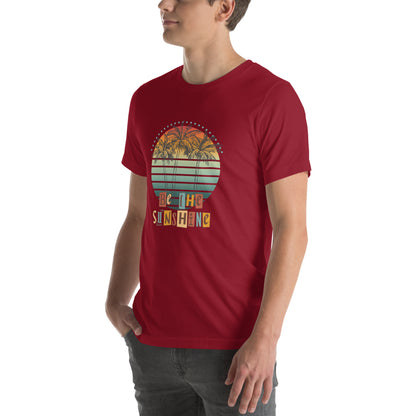 Image 22 of Maroon Solara T-Shirt, size M, with Be the Sunshine artwork visible in front view, left-side angle.